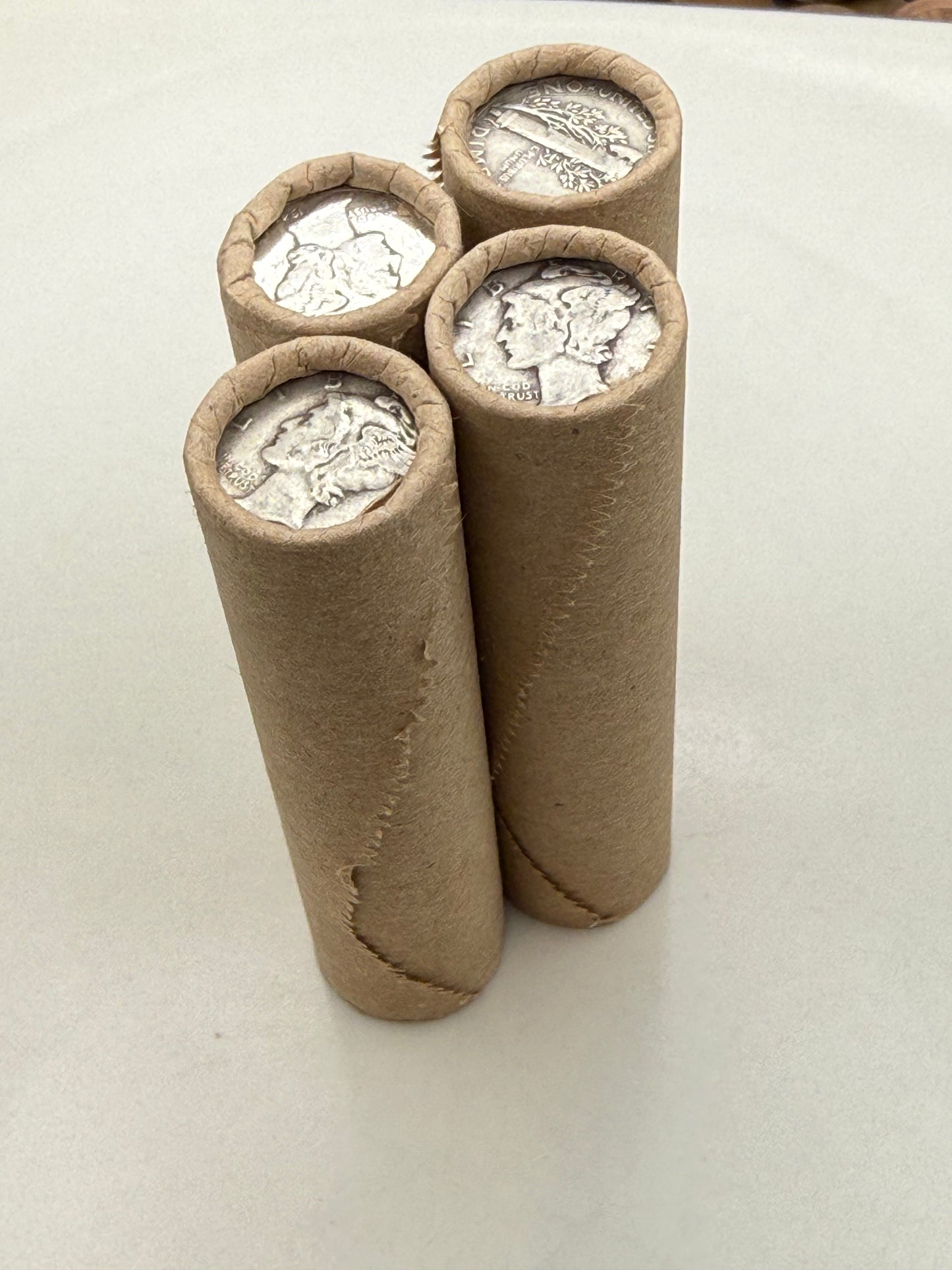 SILVER MERCURY DIME showing on old vintage unsearched old brown wheat penny roll