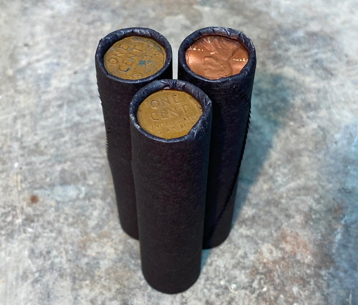 Tightly crimped black wheat penny bank rolls old unsearched coins cent us
